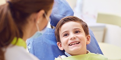 Child visiting dentist for impacted teeth in Carmichael, CA