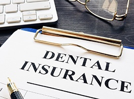 dental insurance paperwork for the cost of dental implants in Carmichael